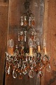 K&Co. presents: 
Old French 
prism 
chandelier with 
lots of clear 
and amber 
colored glass 
prisms...