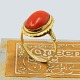 A coral ring in 
14k gold