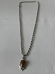 Antik Huset 
presents: 
Silver 
necklace with 
Amber pendant
The necklace 
44.5 cm long