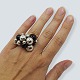 Antik 
Damgaard-
Lauritsen 
presents: 
Georg 
Jensen; A 
Moonlight 
Grapes ring of 
sterling silver 
set with onyx