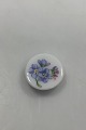 Danam Antik 
presents: 
Royal 
Copenhagen 
Antique Button 
in overglaze 
with flower 2