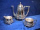 Associations dealer presents: Silver coffypot, cream, sugar