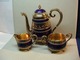 Associations dealer presents: Gilted silver,enamel coffipot, sugar, cream