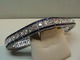 Associations dealer presents: 18 kt. gold braselet with diamonds and blue safires.