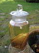 An fluid-preseved bat with big teeth in an old 1900-century laboratiorie glass. Height 21 cm.