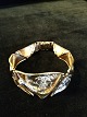 A jewelery set
of 14k red and
white gold, Ole
Lynggaard ...