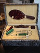 Neat little
toiletry in a
box covered
with snakeskin,
...