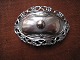 Silver shoes or
belt buckle. L.
9,2 cm. H. 6
cm.