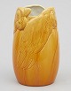 Rörstrand Art
Nouveau vase in
porcelain with
yellow glaze.