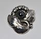 Georg Jensen. A
brooch of
sterling
silver.