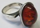 Silver ring
with polished
amber piece,
20th century.
Denmark Silver ring
with polished
amber piece,
20th century.
Denmark
