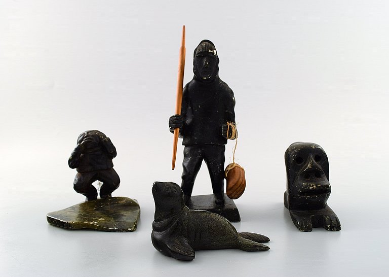 A collection of greenlandica, consisting of four Greenlandic figures of carved 
soap stone.