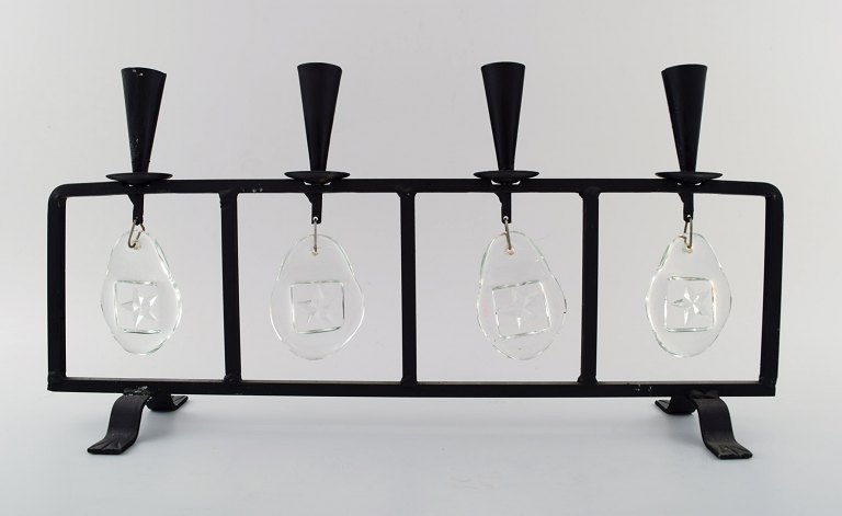 Erik Höglund for Kosta Boda, candleholder in cast iron with mouth blown glasses.