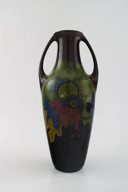 Elrakka, Arnhem, Holland, art nouveau ceramic vase with handles.
Hand painted with flowers.