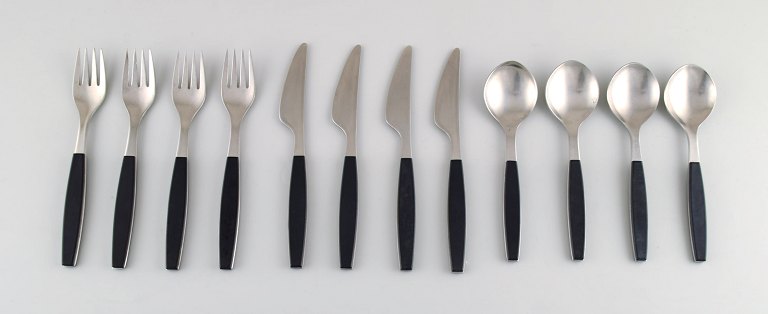Henning Koppel. Complete 4-person dinner service. Strata cutlery stainless steel 
and black plastic. Manufactured by Georg Jensen.
