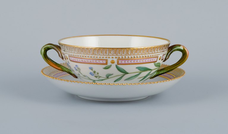 Royal Copenhagen Flora Danica boullion cup with saucer in hand-painted porcelain 
with branch-shaped handles, flowers and gold decoration. 
PROVENANCE : VALDEMARS CASTLE
