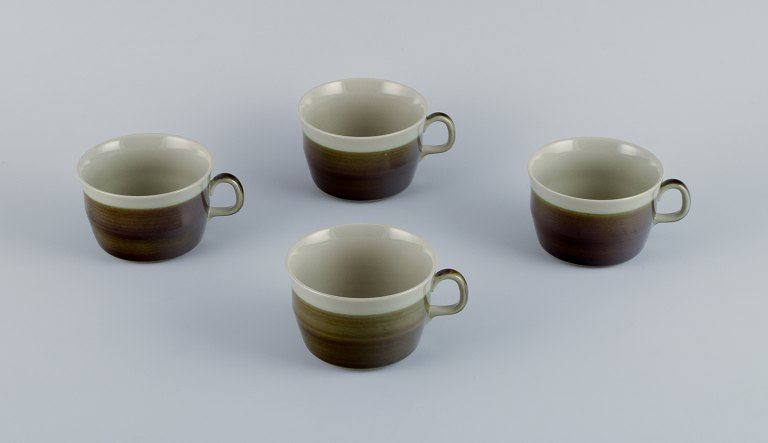Marianne Westman for Rörstrand, "Maya", a set of four coffee cups in stoneware 
with green-brown glaze.
