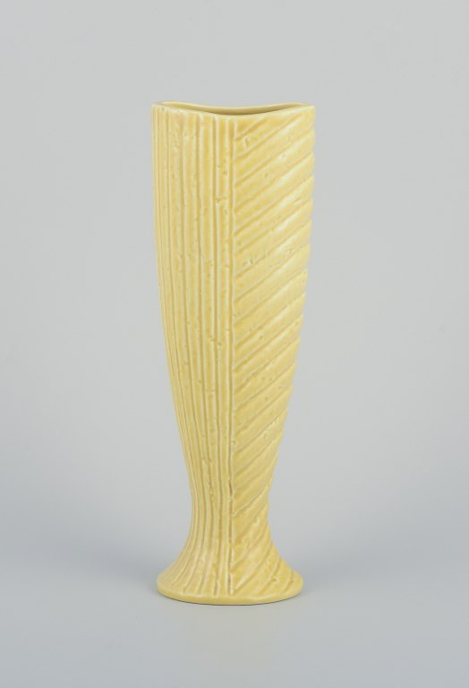 Gunnar Nylund for Rörstrand. Ceramic vase in chamotte clay.
Rare shape. Yellow glaze.