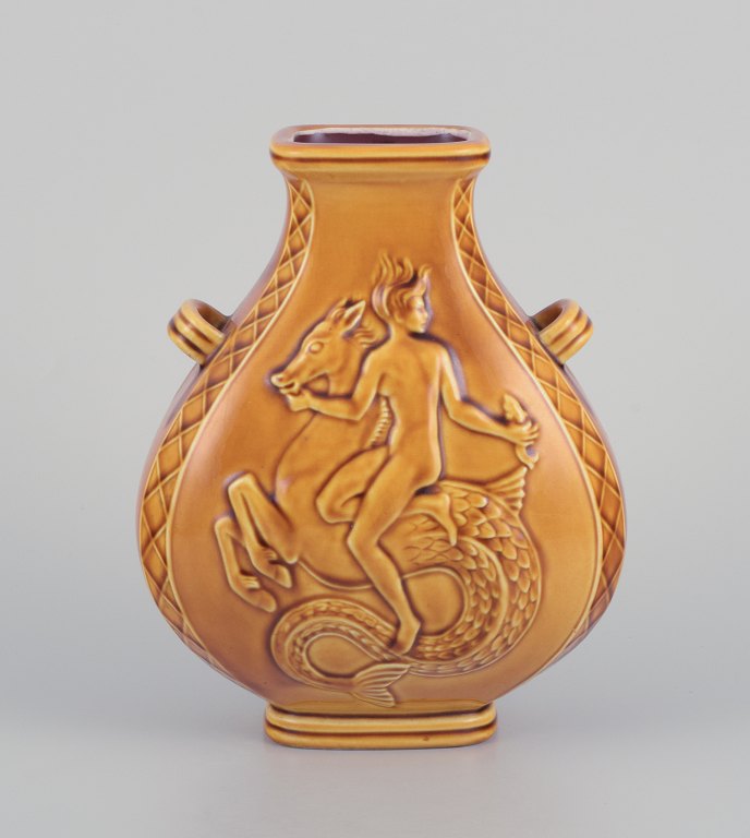 Harald Salomon for Rörstrand, Sweden. Ceramic vase with two handles.
Ochre yellow glaze. Mermaid and sea boy riding on a horse.