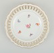 Antique Meissen openwork plate in hand-painted porcelain with flowers and gold 
decoration. Late 19th century.