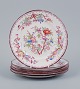 Sarreguemines, France, a set of six porcelain plates, hand painted with floral 
motifs.