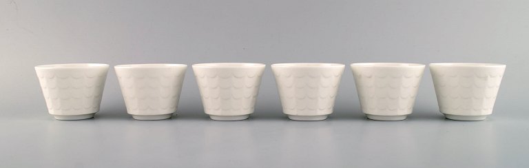 Wilhelm Kåge for Gustavsberg. Six flower pot covers in porcelain. Swedish 
design, 1960s.

