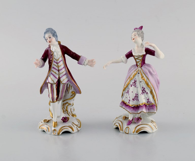 Two German antique porcelain figurines. Rococo couple. 19th century.
