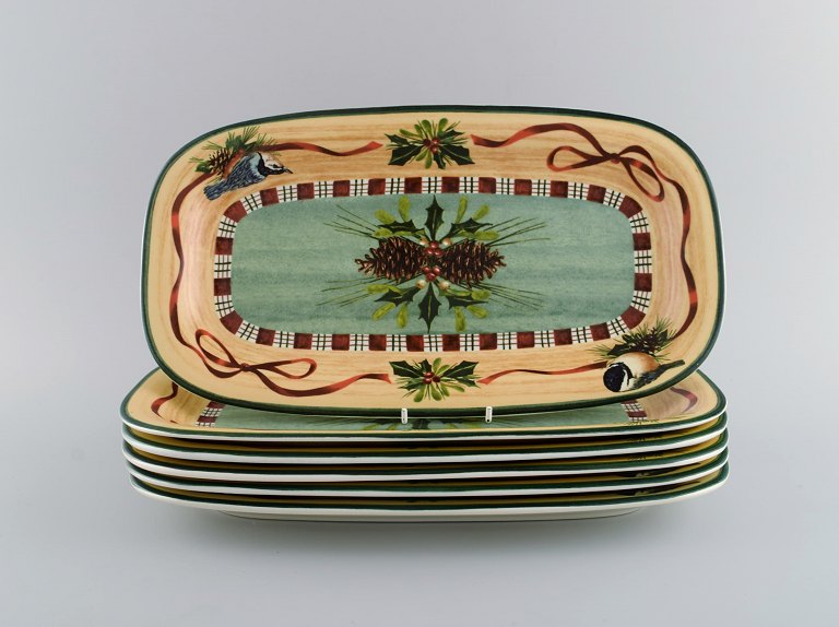 Catherine McClung for Lenox. "Winter greetings". Six oblong dishes in glazed 
stoneware decorated with mistletoe, pine cones and birds. Approx. 2000.

