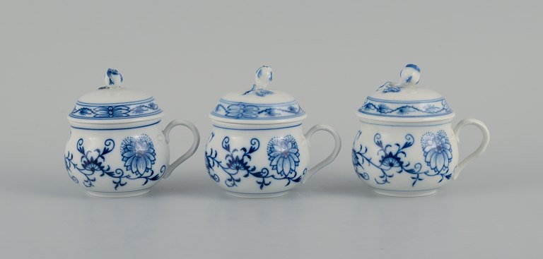 Meissen, three Blue Onion cream cups.