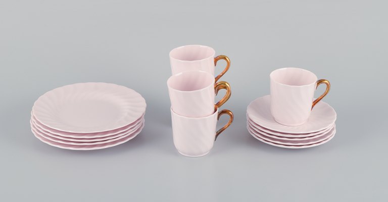 Tuscan, England, five-person coffee service in pink porcelain with gold 
decoration.