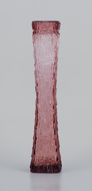 Art glass vase, Central Europe. Tall and slim vase in modern design in purple 
glass.