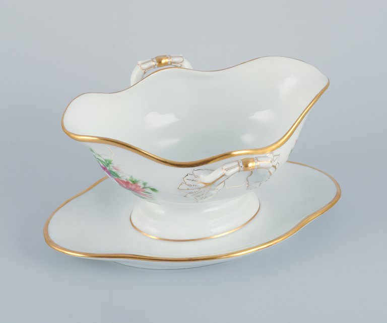 Bing & Grondahl, hand-painted sauce boat with polychrome flower motifs and gold 
trim.