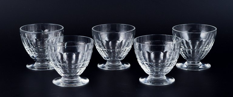 Baccarat, France, a set of five "Charmes" Art Deco white wine glasses in clear 
crystal glass. Faceted cut.