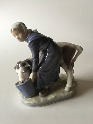 Royal Copenhagen Figurine Girl with Calf No 779