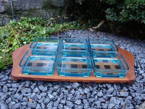 Cabere wood dish with 6 loose greenish glass bowls designed by Quistgaard. 
L: 44 cm W: 25 cm, in perfect condition. 
5000 m2 showroom.