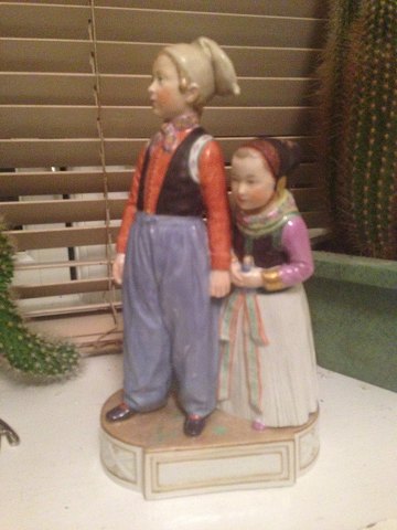 Royal Copenhagen Overglaze figurine of Amager Girl and Boy No 12106