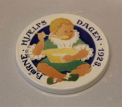 Aluminia Royal Copenhagen faience Children Days plates 
1923 Child eating porrige Oscar Willerup 8.7 cm
