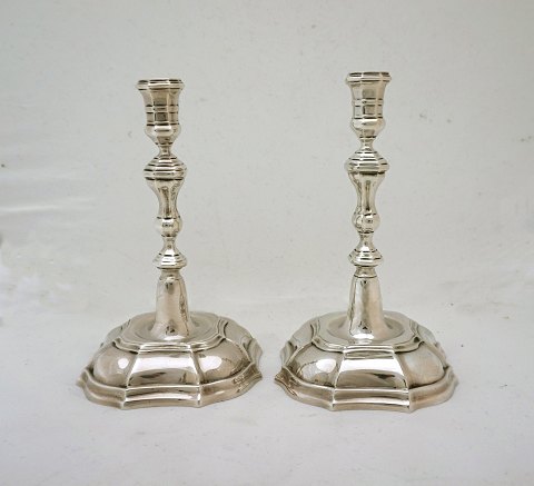 A pair of baroque sterling candle holders