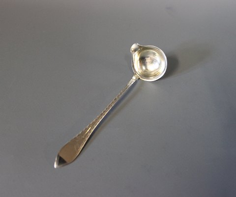 Cream ladle in Empire, Hallmarked silver. 
5000m2 showroom.