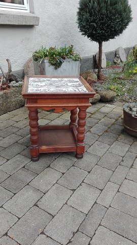 Oak lamp table with 9 tiles decorated with 
biblical motif