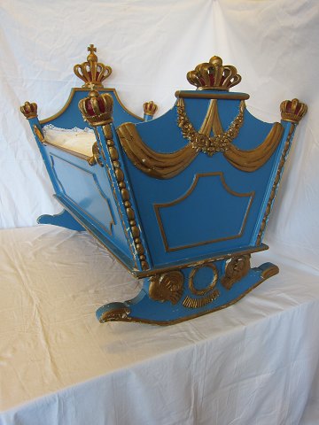 Cradle made of blue-painted and partial gilt wood. 
Originally intended for the princess Anne-Marie of Denmark, sister to her 
majesty the Queen Margrethe II of Denmark.
Made in 1946 by a master cabinetmaker from Copenhagen.