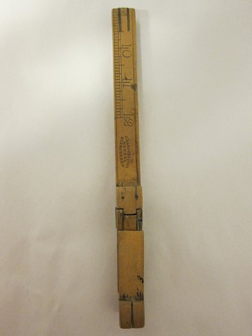 Tool for measuring the feet
An old collapsible tool, used by the shoemaker for measuring the lenght of the 
feet, to find the correct size of the shoe
Possible to read English sizes og Paris points as well
Made of brass and wood
Stamp: J.Rabone & Sons