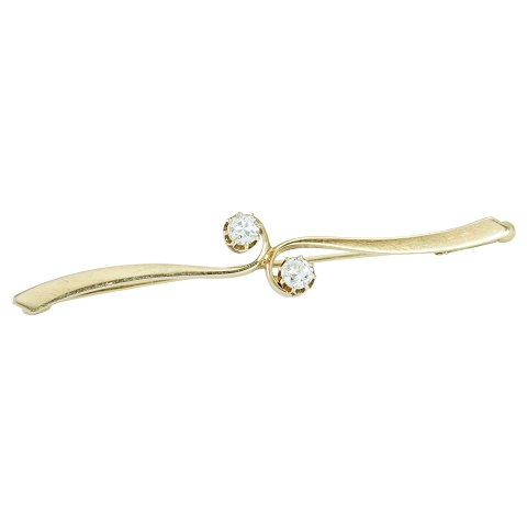 A brillant brooch of 14k gold