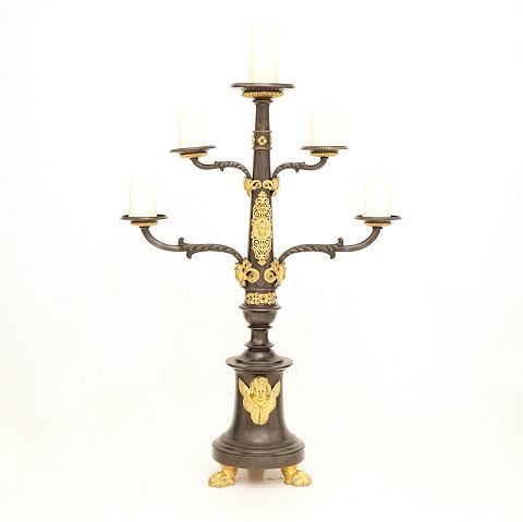 A large gilt bronze candlestick for five candles. 
France circa 1850. H: 95cm. W: 66cm