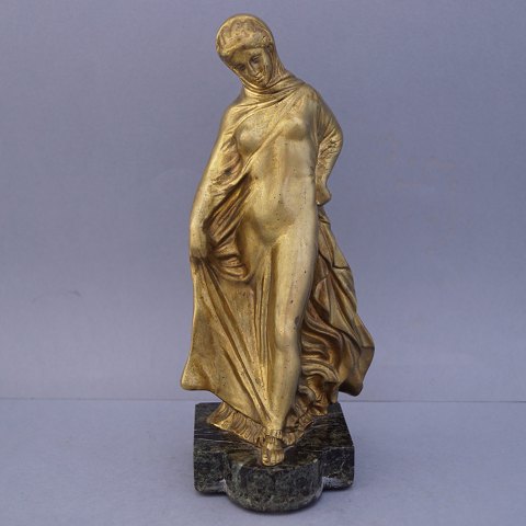 Gold-plated bronzefigure; standing naked woman with loose robes from the 
beginning of the 20th century