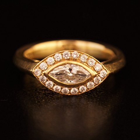 Hartmanns; A ring set with 1 big river diamant and 18 smaller mounted in 18k 
gold