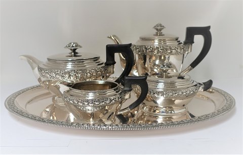 German The-coffee service. 5 parts, consisting of coffee pot, tea pot, creamer, 
sugar bowl and tray. Produced by L. Holtbur Nachf, Leipzig. Silver (800)