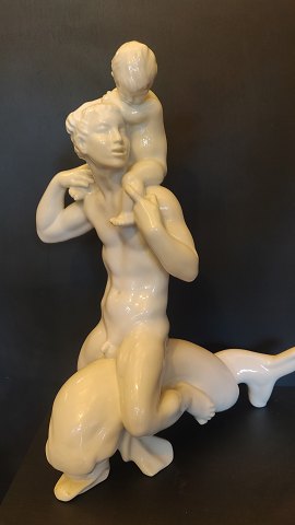 Kai Nielsen, Bing og groendahl Man with boy riding a dolphin. 42cm .1 .