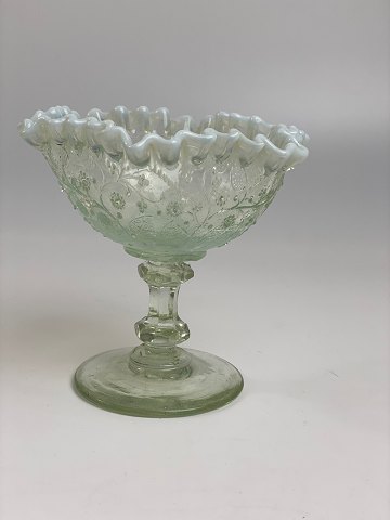 Old sugar bowl on foot; clear glass  with white ruffle edge