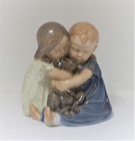 Royal Copenhagen. Porcelain figure. Children with dog. Model 707. Height 15 cm. 
(1 quality)